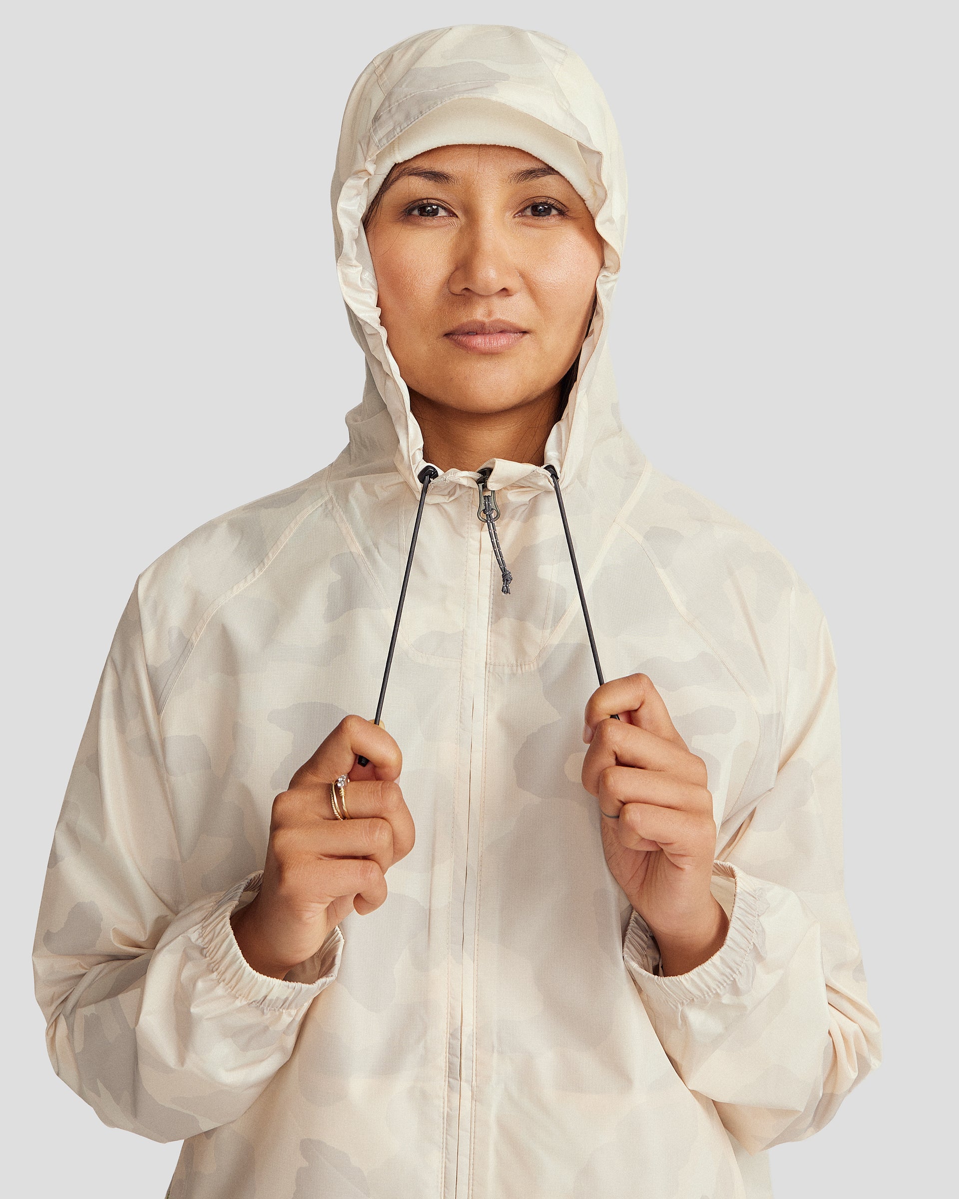 a1392_oqi_pocket_it_2l_womens_rain_jacket_v4_neutral_multi_m_e_1745458713000